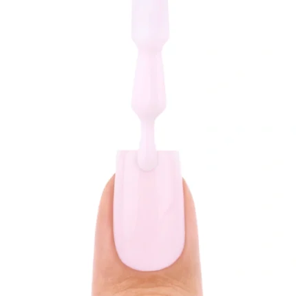 Nails Company Smart Base Pro – swatch kremowo-różowej bazy na paznokciu z pędzelkiem nad nim